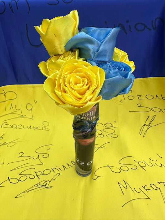 30mm canon shell wrapped in sticker from 22nd Separate Special Forces Battalion filled with handmade blue and yellow flowers!