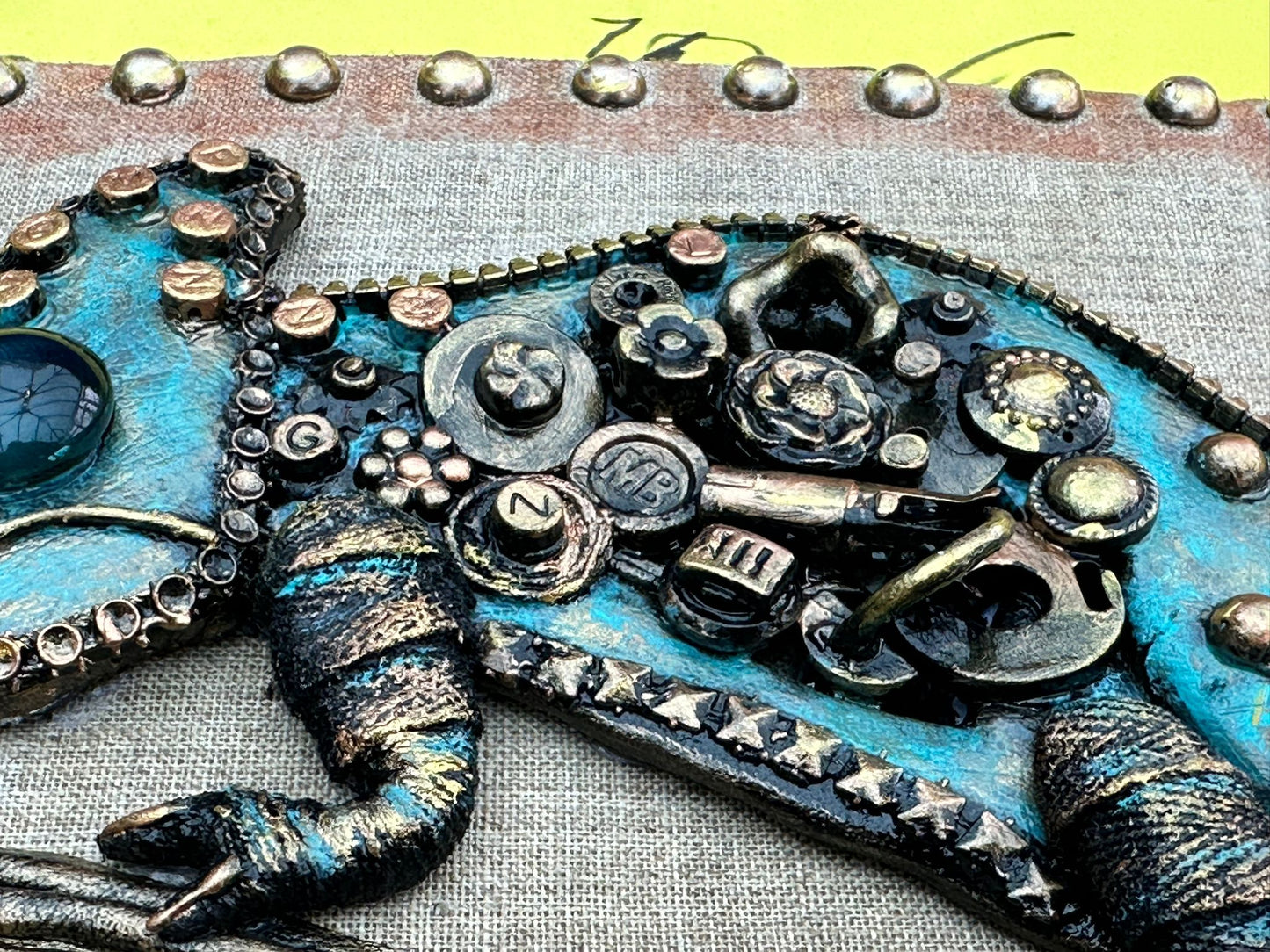 Handmade Steampunk Type Chameleon on fabric background. Totally Unique!